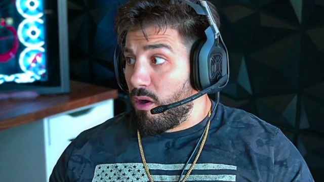 NICKMERCS wearing a headset, looking confused.