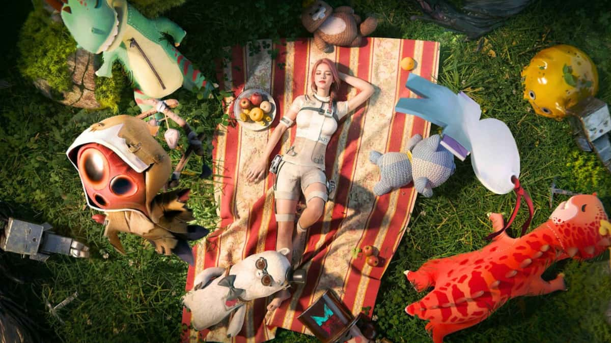 A woman lies on a beach towel on grass