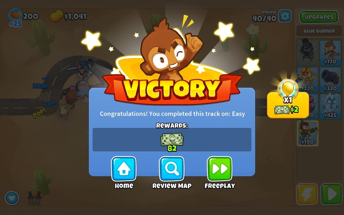 The victory screen depicting rewards and navigation options with a bonus Monkey Money indicator for Golden Bloons popped in BTD6.