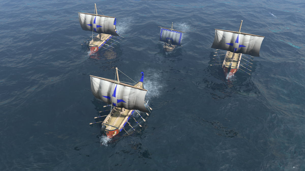 Four ships sail through the water in a diamond formation.