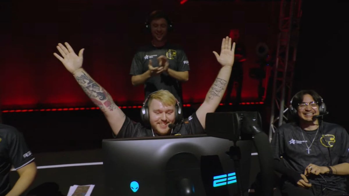 ImMadness lifting his hands up with Vaxlon to his left smiling at the Split 2 Playoffs