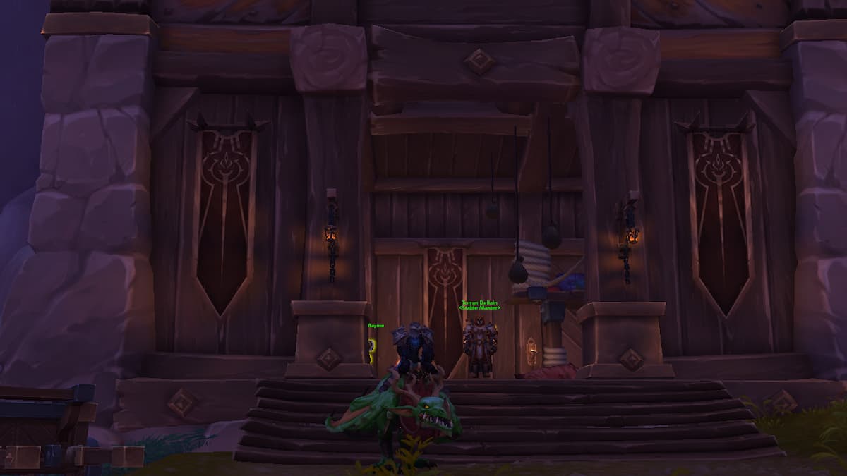 A large building with pillars in Dunelle's Kindness within Hallowfell zone The War Within with a Death Knight and merchant in doorway