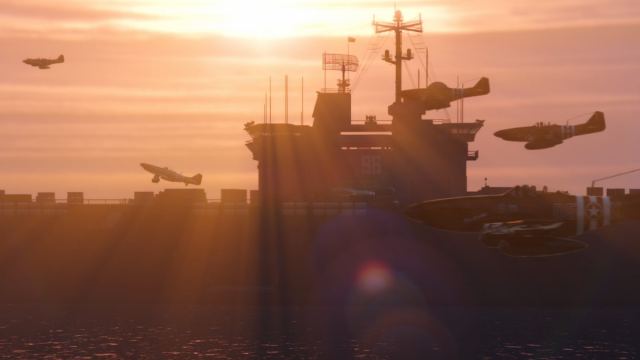 An image of the new Assault on ATT-16 adversary mode. This allows you to spawn on an aircraft carrier and battle against other players with military grade weapons. The photo shows several fighter jets flying past the aircraft carrier.