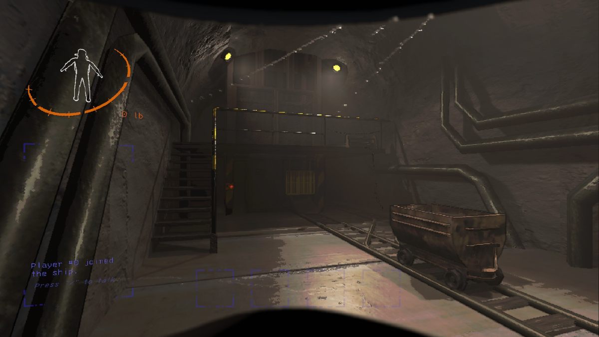 Image of the Mineshaft interior entrance in Lethal Company with mine cart, staircase, and elevator down into the mines visible from the front door