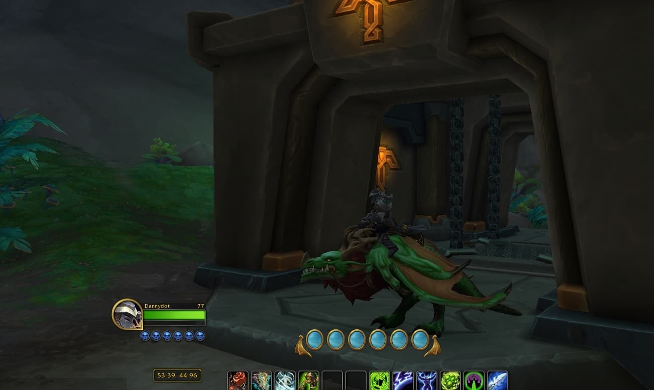 Black and silver Death Knight sitting on green and maroon dragon outside of Pillarstone Spire in the Ringing Deeps WoW The War Within