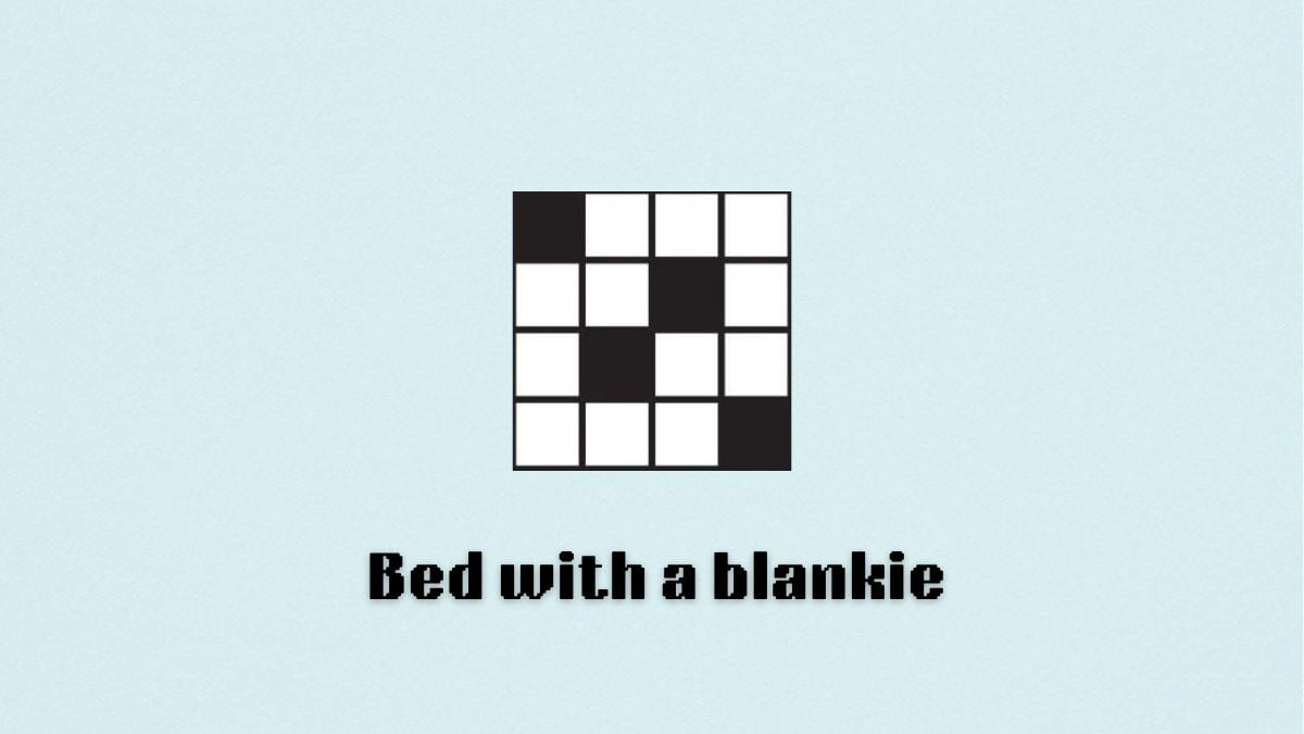 The words "bed with a blankie" under a blank crossword puzzle