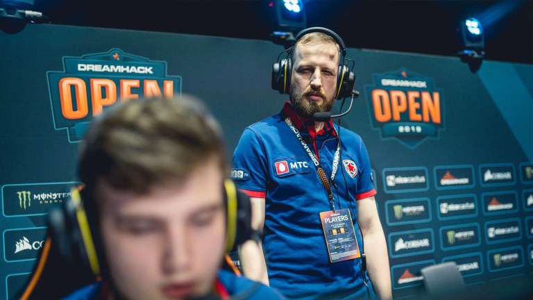 F_1N, standing behind his team Gambit Youngsters and coaching at a Dreamhack CSGO event.