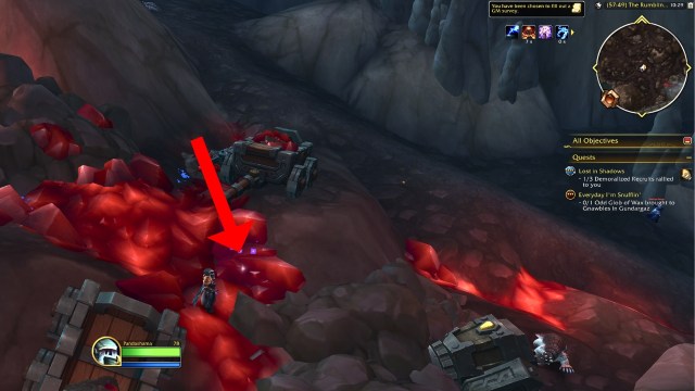 A red arrow pointing to the ruby for dusty prospectors chest wow the war within