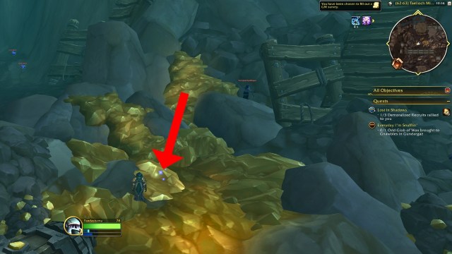 A red arrow pointing to the topaz gem for dusty prospectors chest wow the war within