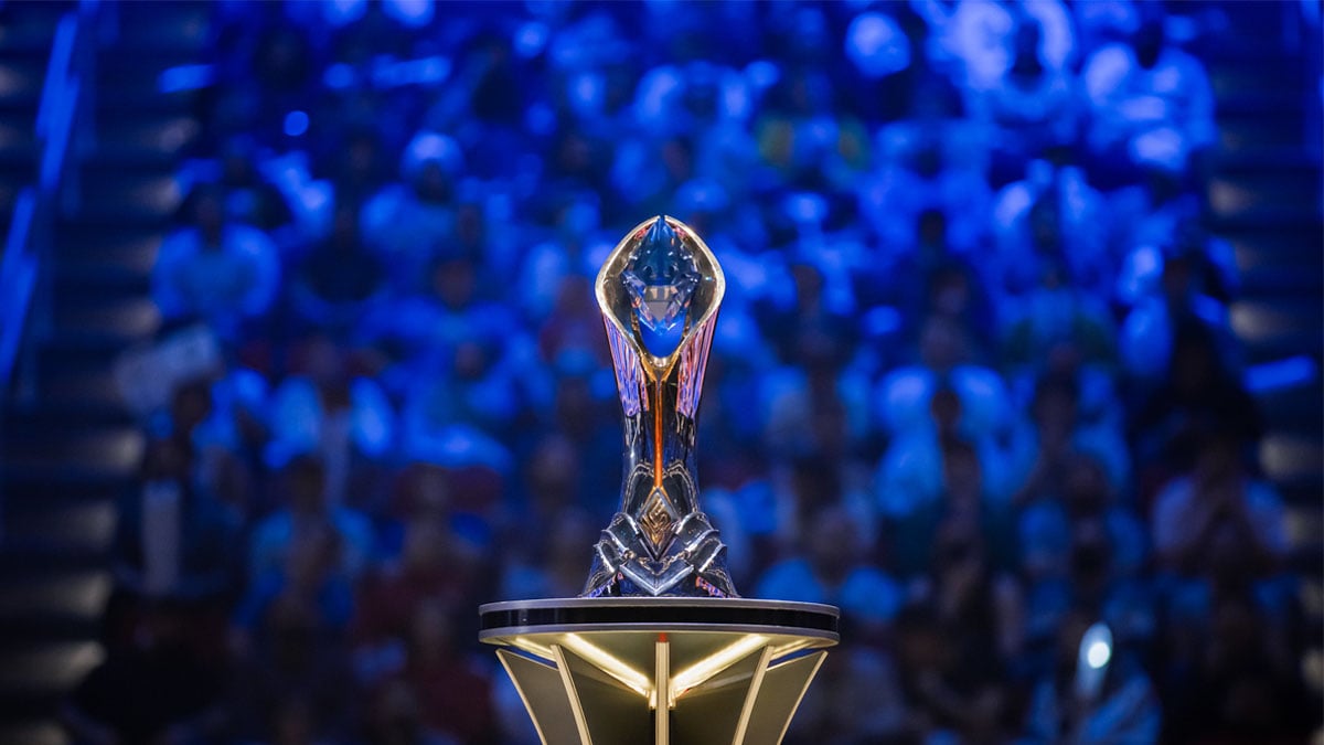 The LCS trophy sits on a plinth in front of a crowd.