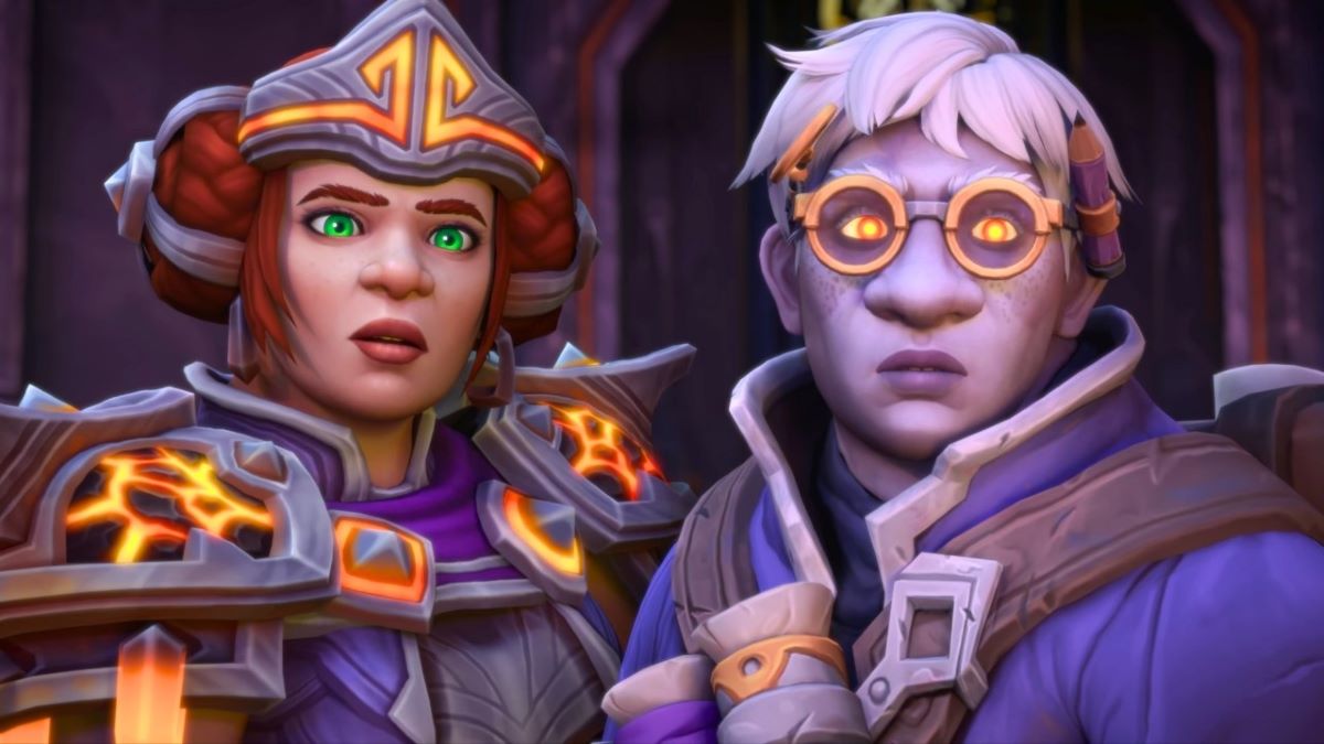 Moira, a woman dwarf with a helmet and armor standing next to a male dwarf with glasses.