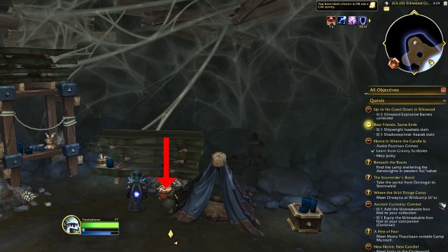 A red arrow pointing to a silkwood explosive barrel in wow the war within