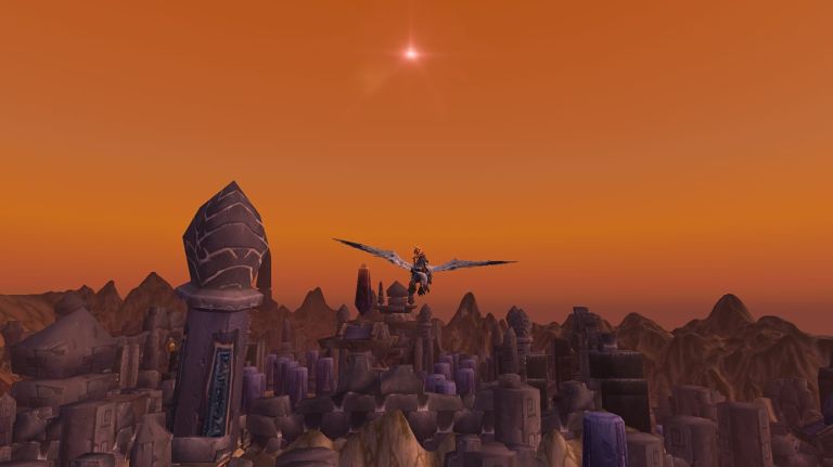 Character in World of Warcraft flying over a classic raid with a sunset.