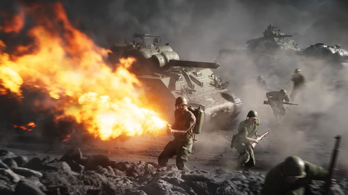 Soldier firing a flamethrower with fellow soldiers and tanks in the background