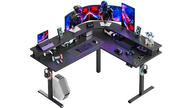 Bestier L-shaped gaming desk with monitors and gaming equipment