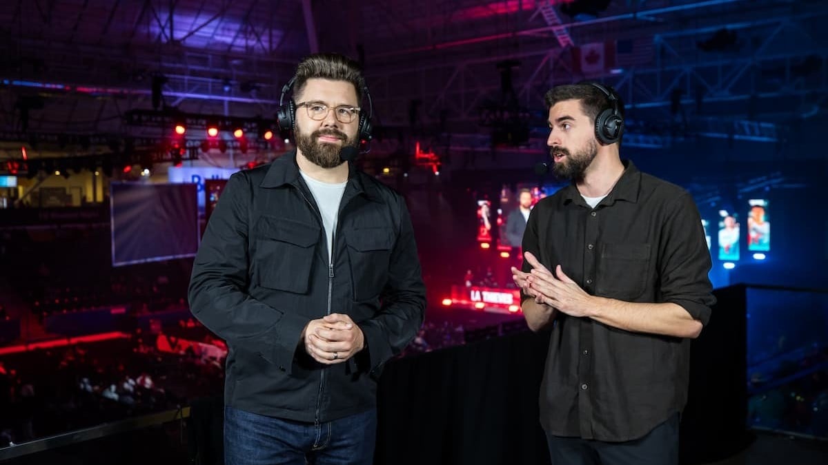 CoD casters Miles Ross and Chance standing side by side while commentating over gameplay.