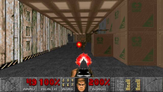 Shooting enemies in DOOM with character face model, health, and ammunition visible in bottom bar