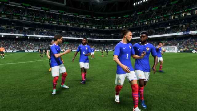 A team in EA FC 25 Ultimate Team wearing the France home kit leaving the field.