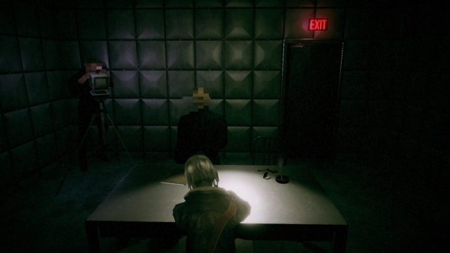 Mica being interrogated in a dark room by two men with blurry faces