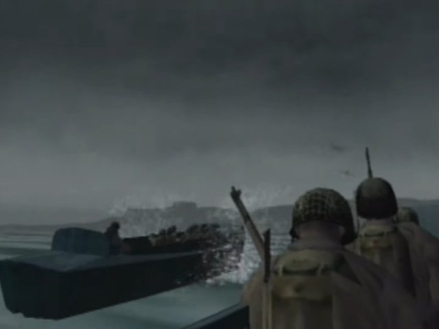 Looking at the back of two soldier's helmets as the boat comes in for D Day