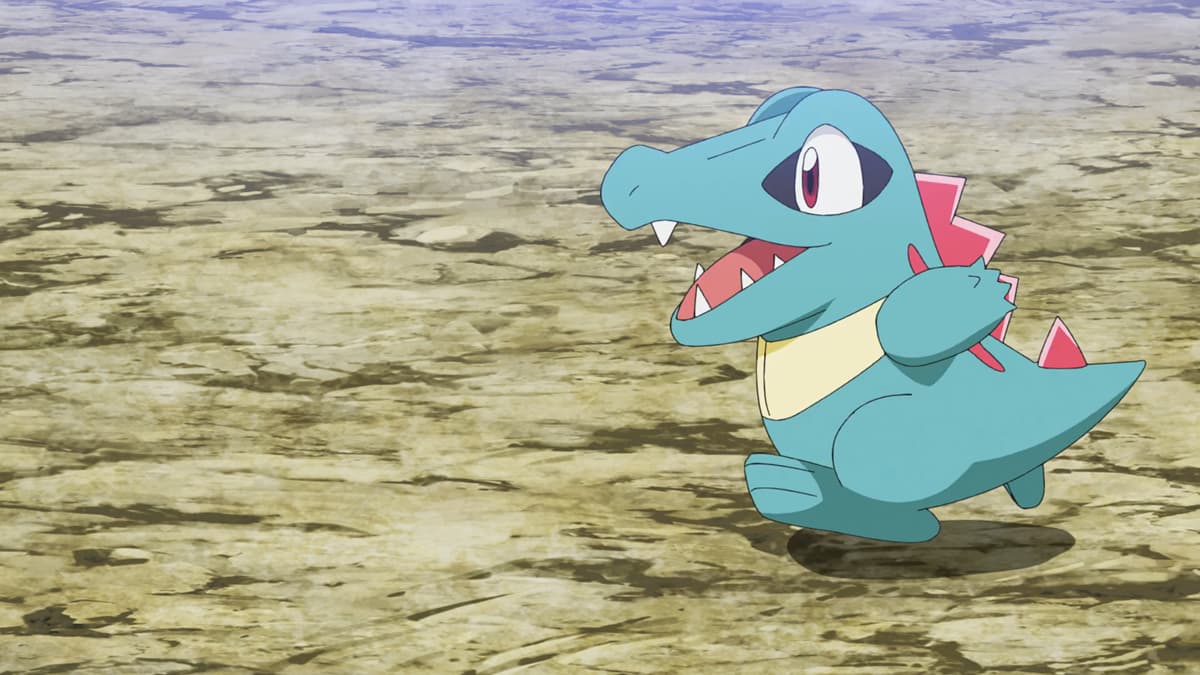 Totodile running to the side on a rocky patch