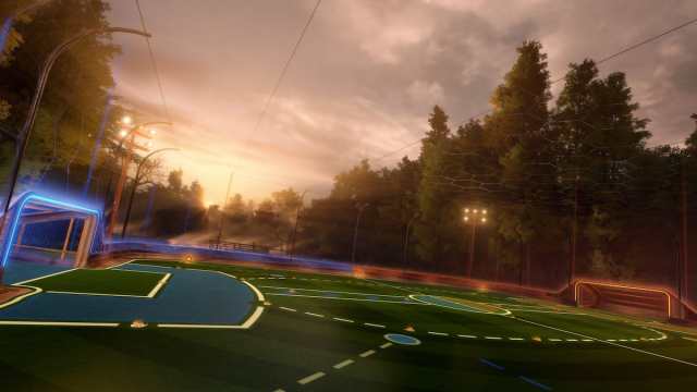 An image of the Drift Woods Arena, a new location in Rocket League. This arena is located inside a vast forest filled with tall trees and a cloudy sky.