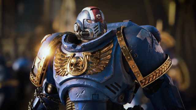 A closeup shot of a character in blue armor in Warhammer 40K Space Marine 2.