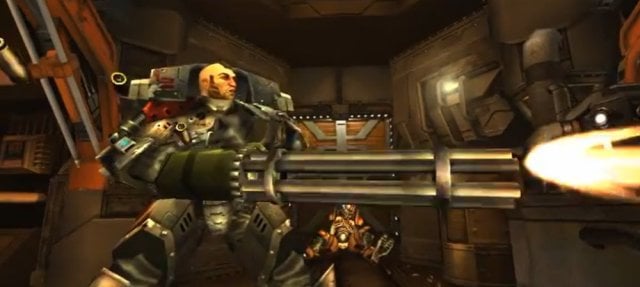 A side shot of a heavy build character holding a mini-gun and shooting