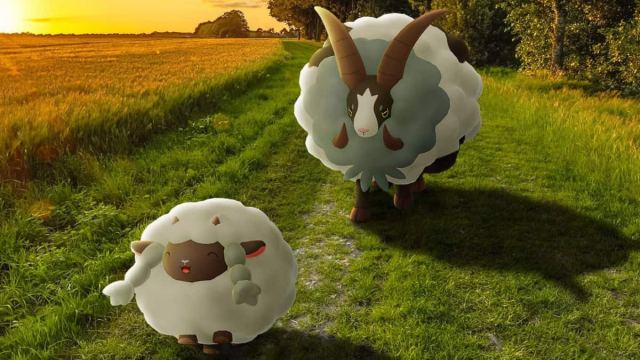 Wooloo and Dubwool on a grassy field in Pokémon Go.