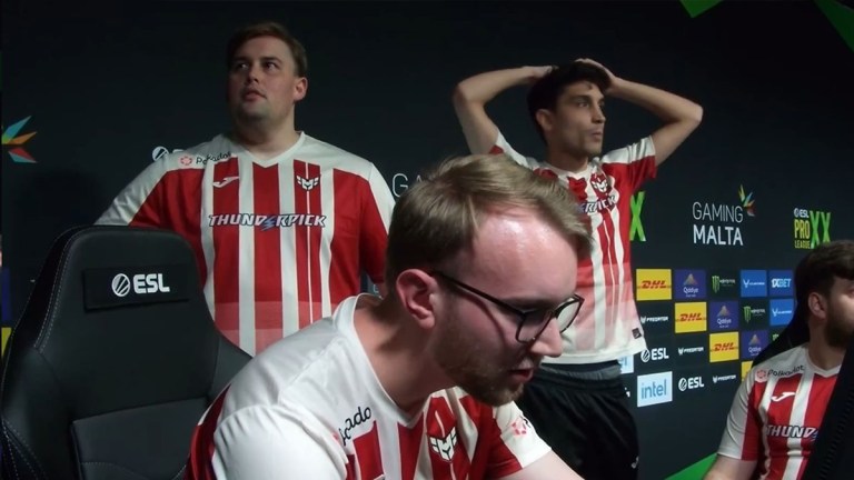 TeSeS (middle) sitting and looking stressed as his HEROIC teammates stand behind him at ESL Pro League Season 20.