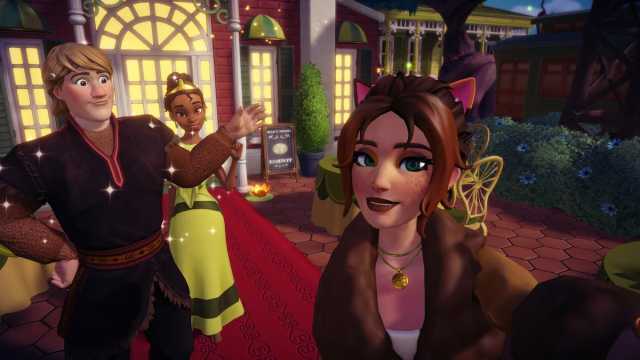 The player, Kristoff, and Tiana posing in front of the Victory sign in Disney Dreamlight Valley.