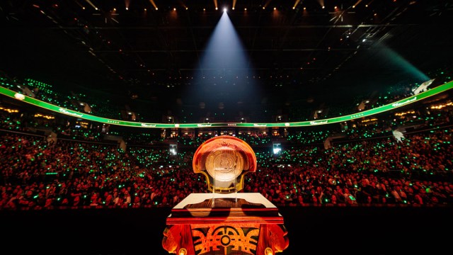 The Aegis of Champions sits on a plinth with a crowd looking at it from the stands.