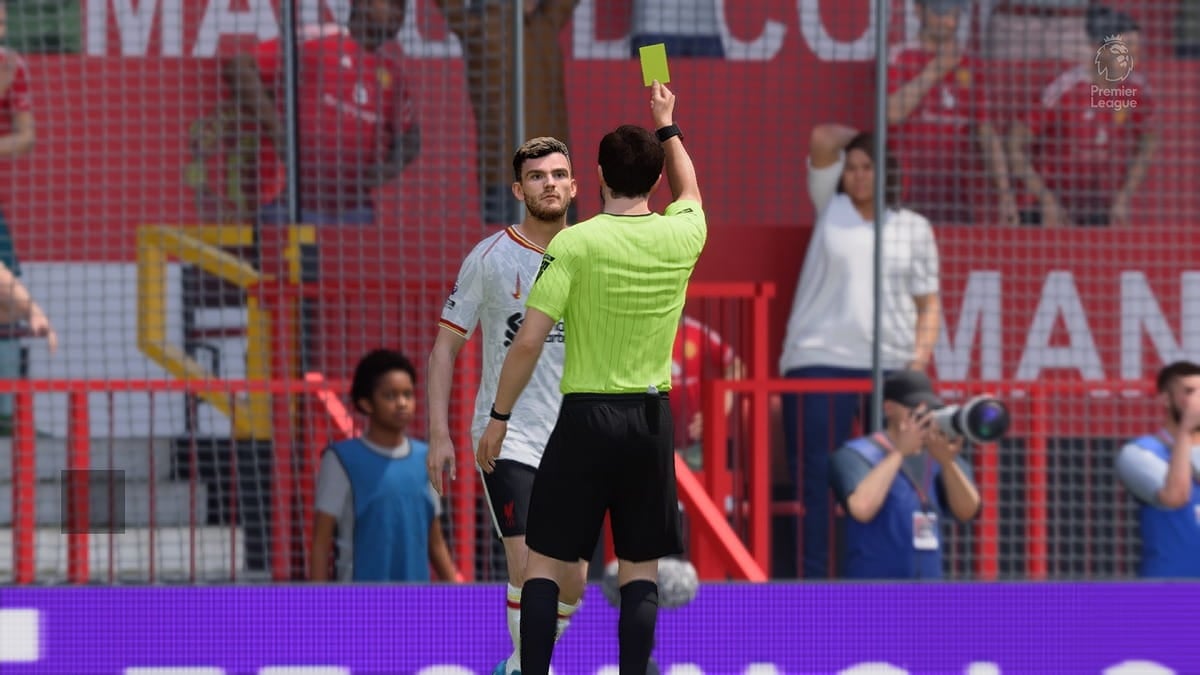 Andrew Robertson receiving a yellow card in EA FC 25