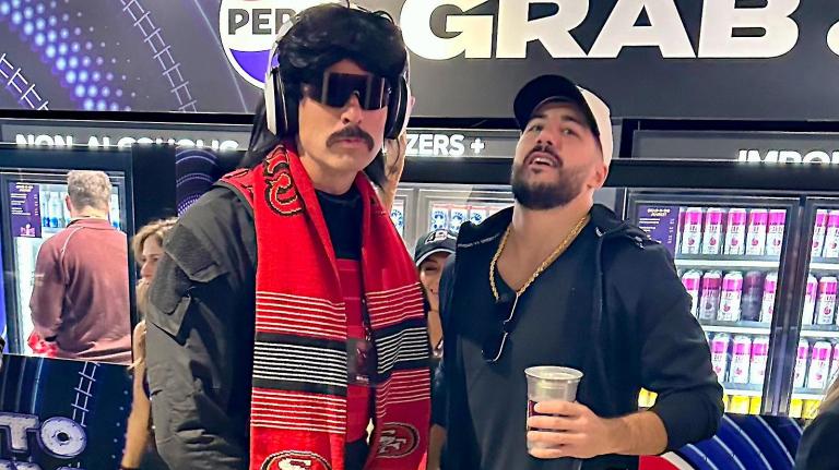 Dr Disrespect in his full costume and Nikmercs with a beer in hand embrace at the Super Bowl in 2024