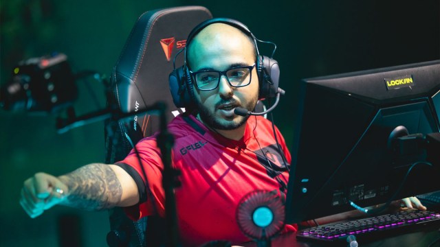 Sacy sits at his PC and fist-bumps his Sentinels teammate at the VCT LOCK//IN event in Brazil.