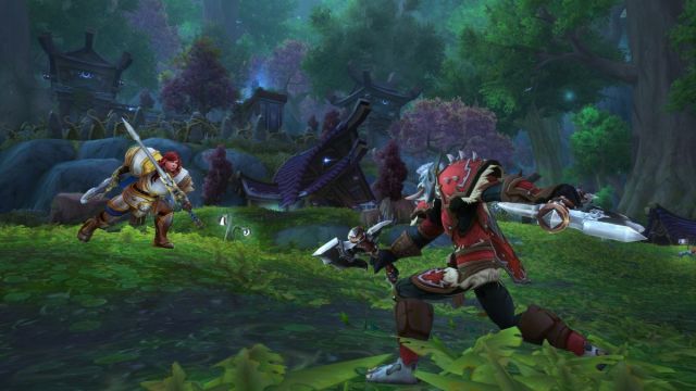 Two warriors battling it out in World of Warcraft Arathi Basin.