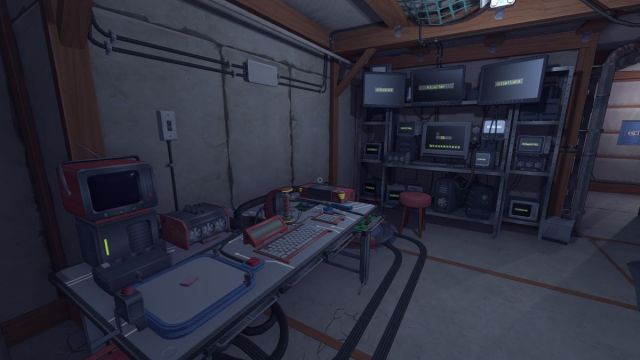 A shot of the workshop table and computer with ID tag input on the monitors, with the Cartridge spawn visible on the scanner