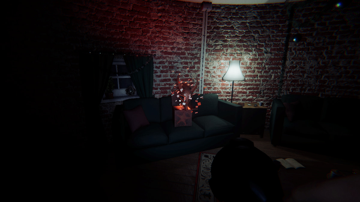 a krampus box on a green couch in the living room in phasmophobia. 