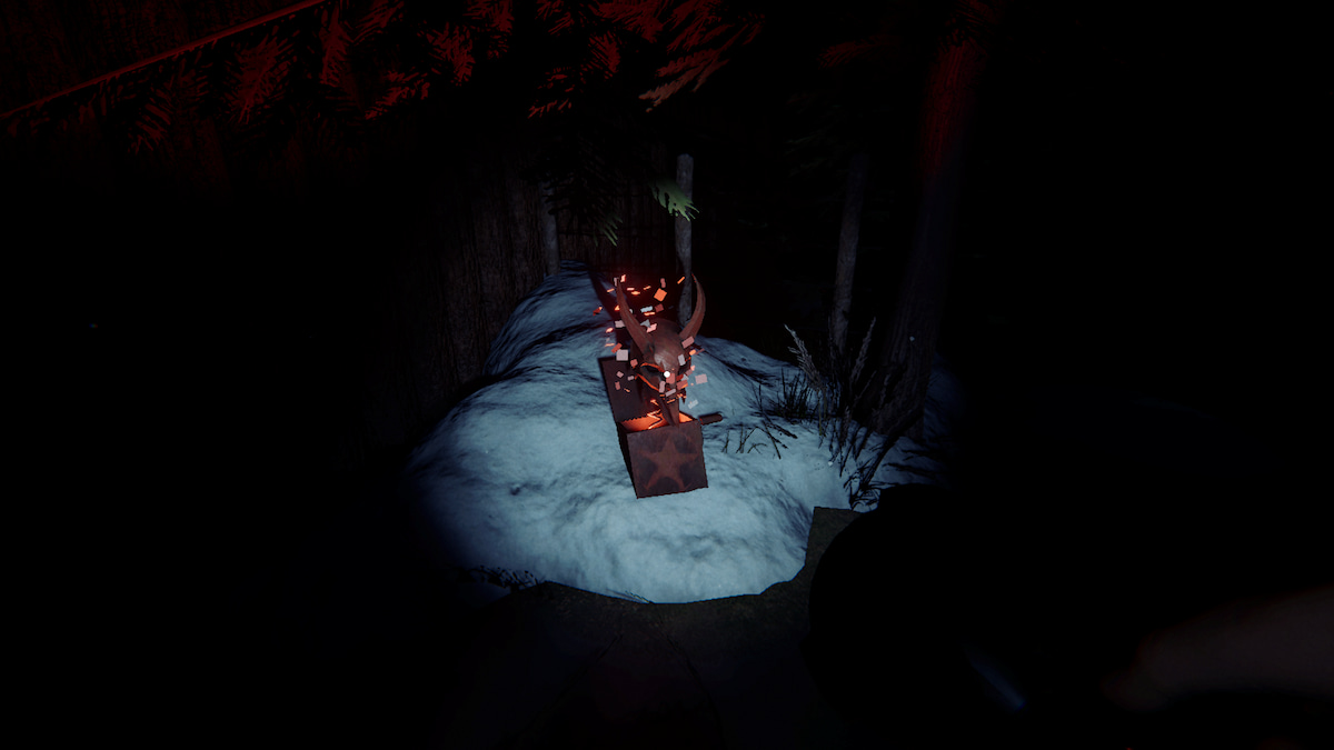 a krampus box on the ground in some snow in phasmophobia. 