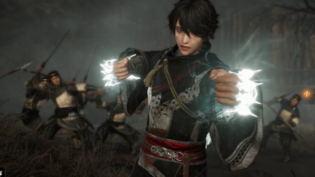 Dynasty Warriors Origins protagonist with glowing gauntlet weapons ready to fight