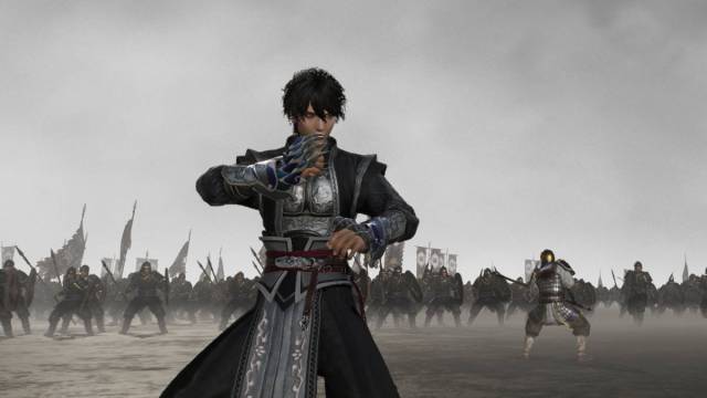Dynasty Warriors Origins weapon tier list: the nameless protagonist stands with a set of gauntlets in a cloudy void filled with enemies.