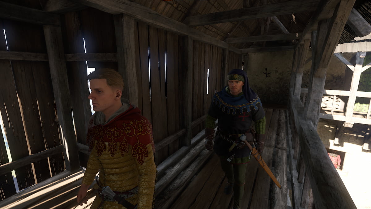 Two men walk down a hallway in Kingdom Come 2.