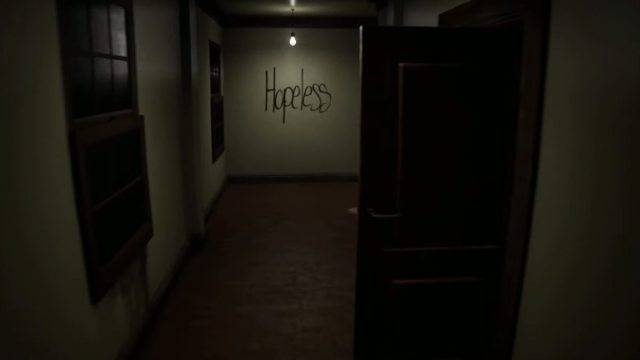 One of the IN THE FACADE WE TRUST loops with hopeless written on the wall at the end of the corridor with an opened door to the immediate right