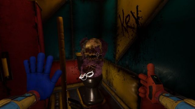 Looking at half of Riley's Bigger Body with the key dangling out of her ribcage and the word "KEY" in blood on the wall next to her