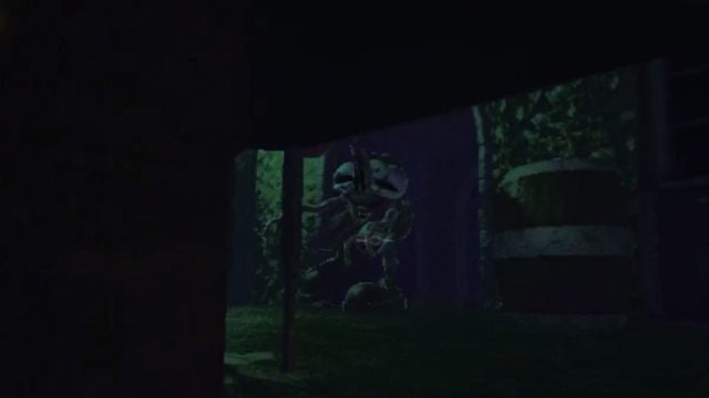 A shot of the Clown walking through a door, taken from underneath a table