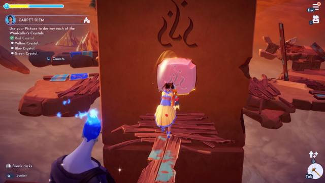 Breaking a red crystal with a pickaxe in Disney Dreamlight Valley
