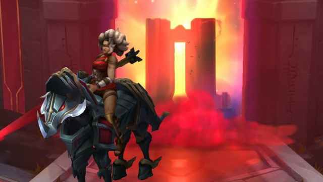 A woman riding on a horse with a flaming pillar behind her emitting smoke and light in League of Legends.