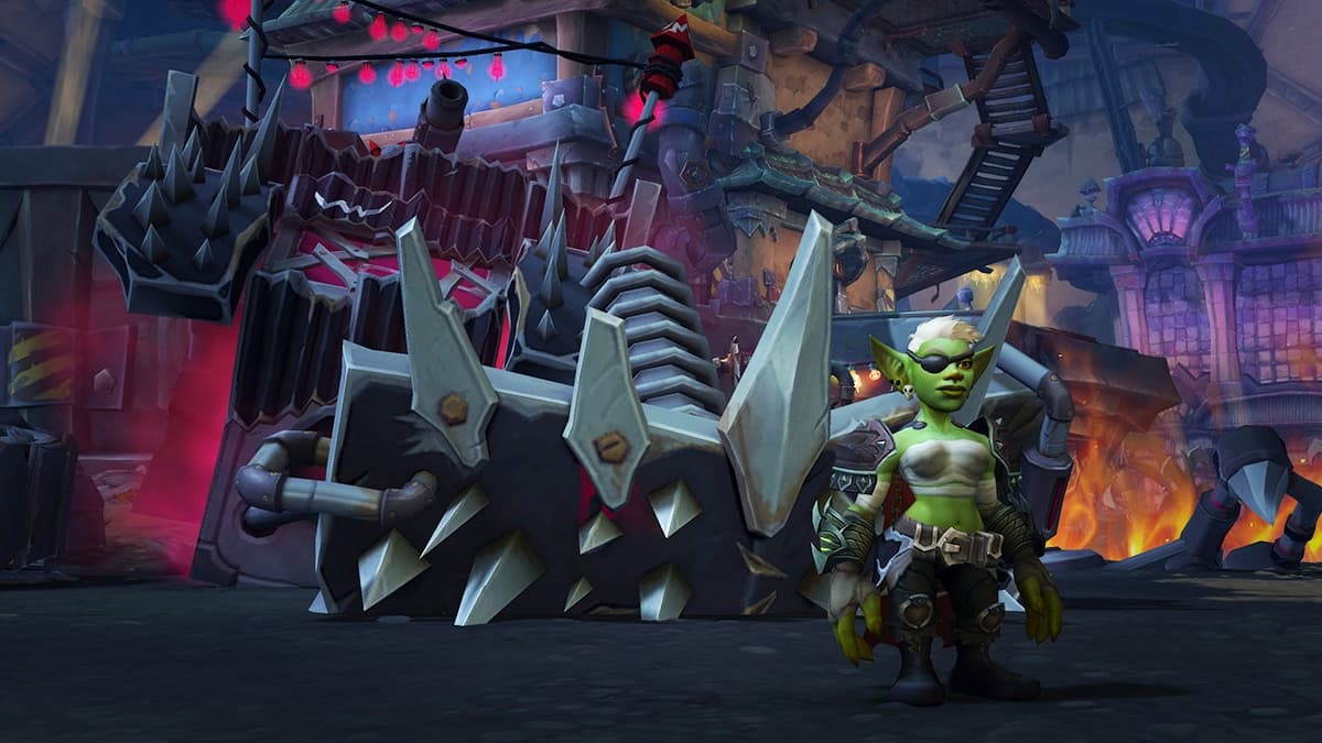 A female Goblin in front of a black monstertruck.