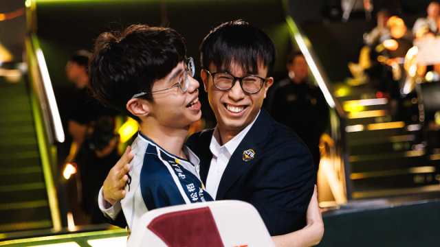 Kaiwing (L) and coach Chawy of CTBC Flying Oyster hug onstage at First Stand Tournament 2025 Round Robin Stage on March 11, 2025 at LoL Park in Seoul, Korea.