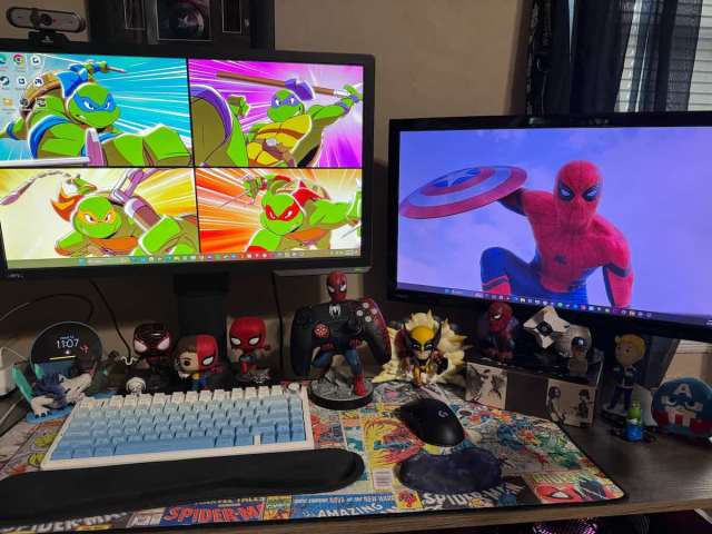 Desktop setup filled with Spider-Man stuff